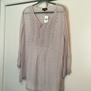 Ladies top. New with tags. Soft lilac color.